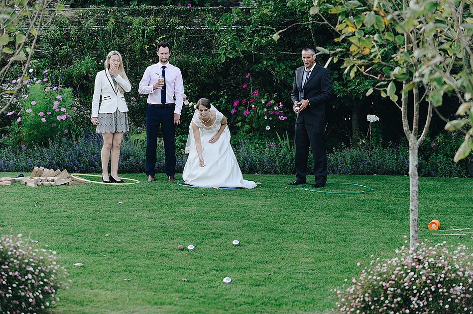 bride playing lawn games boules at Shilstone House wedding